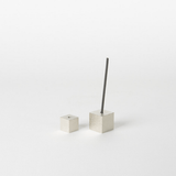 Silver cube incense holder set on a white background, with one cube holding a vertical incense stick and the other placed beside it, highlighting minimalist Japanese home decor aesthetics.