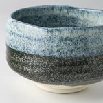 Close-up of the Seifu blue matcha bowl highlighting its textured hand-glazed surface, with layered blue and deep charcoal tones crafted in Mino ware tradition.