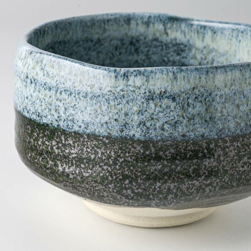 Close-up of the Seifu blue matcha bowl highlighting its textured hand-glazed surface, with layered blue and deep charcoal tones crafted in Mino ware tradition.