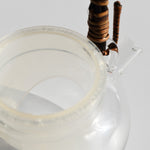 Close-up of glass kyusu teapot with fine mesh infuser and rattan handle, 250ml Japanese loose leaf tea pot.