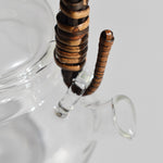 Close-up detail of glass kyusu teapot with rattan wrapped handle and clear side spout, 250ml Japanese tea pot.