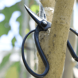 Hidehisa ikebana shears cutting woody stems with precision and control