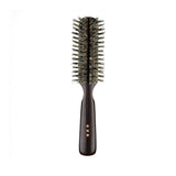 Japanese round hair brush made with soft natural bristles and a dark ebony wood handle, designed for gentle styling, smoothing, and adding shine.