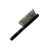 Side view of the Kanaya travel hairbrush with soft boar bristles and a compact black wooden handle. Designed for on-the-go grooming, the slim profile makes it easy to pack without sacrificing brushing performance.