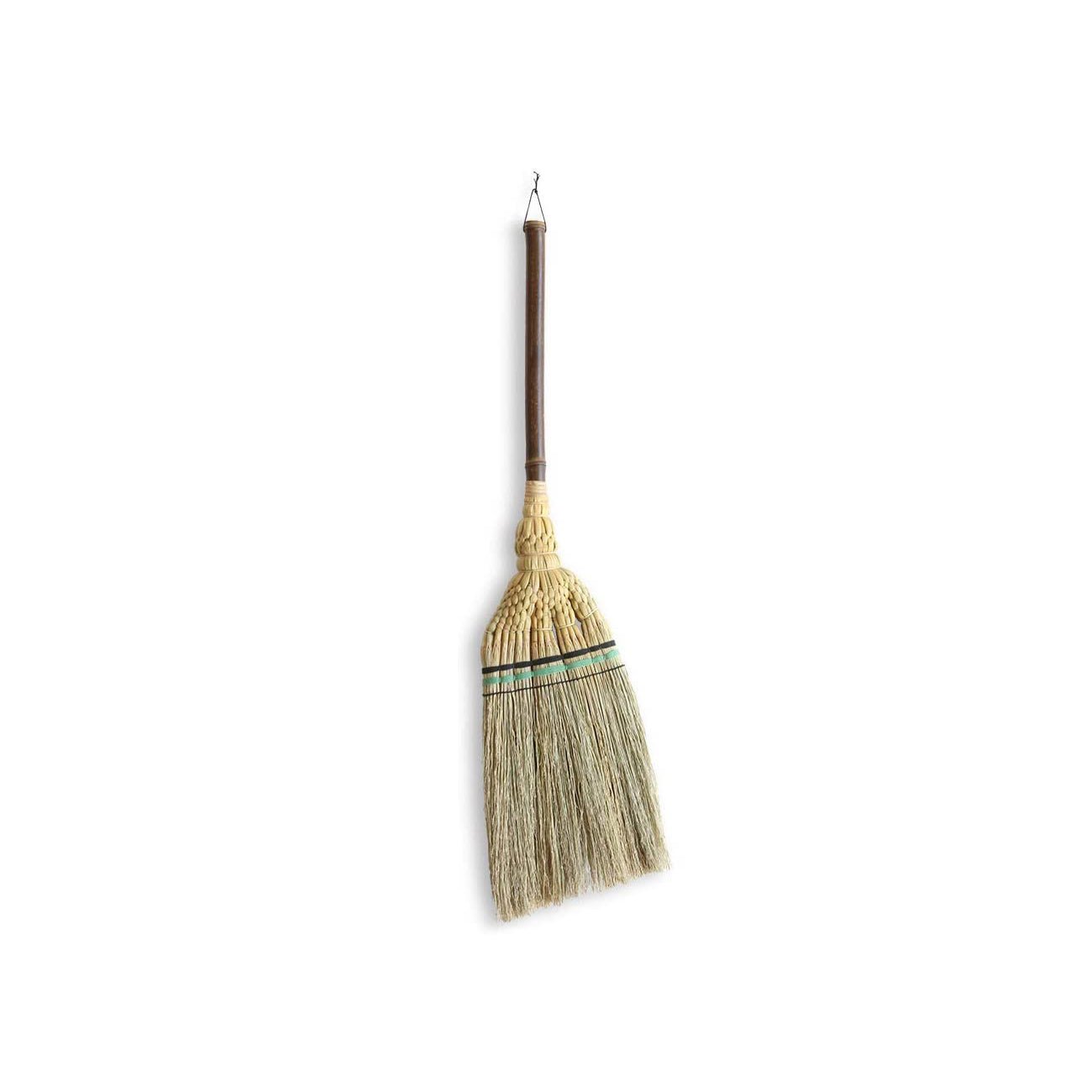 Traditional Japanese Edo-style broom handcrafted by Shirokiya Denbei artisans, featuring a short, dark wooden handle and tightly bound natural straw bristles. The bristle base is intricately woven with decorative green and black thread bands, showcasing the refined aesthetics and durability of Edo-period craftsmanship. Ideal for indoor sweeping, this broom blends practicality with timeless design, reflecting centuries-old Japanese broom-making heritage.