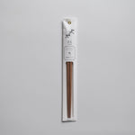 Minimalist packaged chopsticks made from Japanese ume (plum) wood with a delicate floral label design